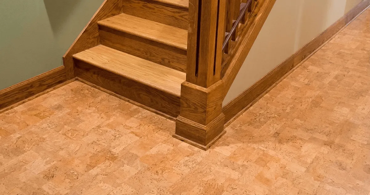 End of a staircase with cork flooring in El Paso, TX