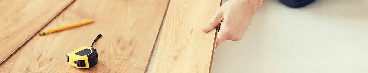 A professional installing wood flooring in El Paso, TX