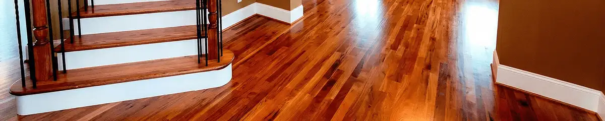 Base floor of a staircase with professionally restored wood flooring in El Paso TX