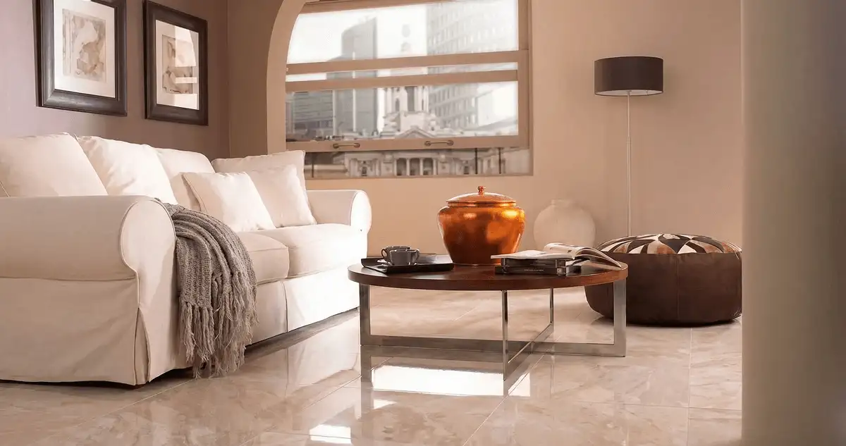 Modern living room with professionally installed marble flooring, a beige sofa, coffee table in El Paso, TX
