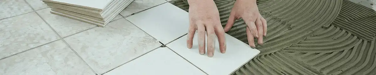 Professional installing white tile floors in El Paso, TX