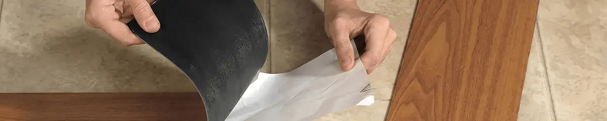 A professional installing vinyl flooring in El Paso, TX