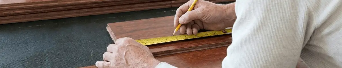 A professional installing wood flooring in El Paso, TX